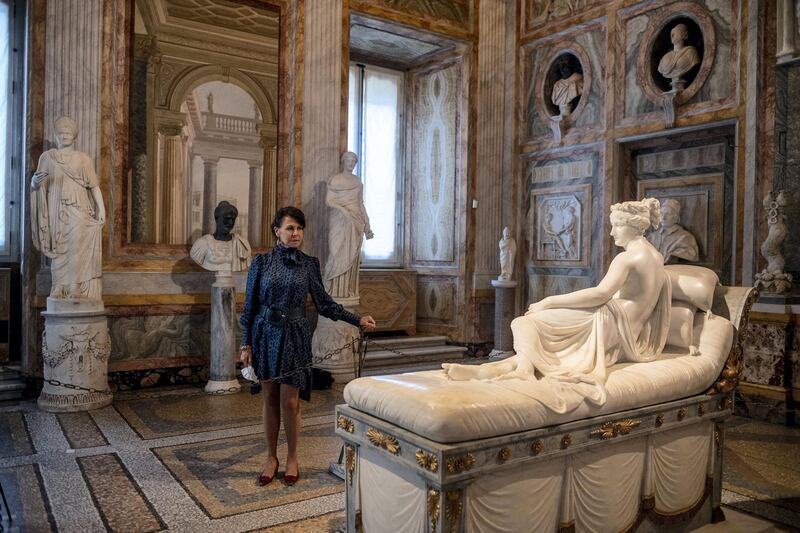 ROME, ITALY - MAY 19: (EDITORIAL USE ONLY) Galleria Borghese Director Anna Coliva poses in front of the sculpture "Paolina Borghese Bonaparte" realized by the Italian Artist Antonio Canova, at the Galleria Borghese after two months of closure, during Italy's phase two coronavirus (Covid-19) lockdown exit plan, on May 19, 2020 in Rome, Italy. Galleria Borghese is reopening its doors to the public after the lockdown due to the Covid-19 pandemic. (Photo by Antonio Masiello/Getty Images)