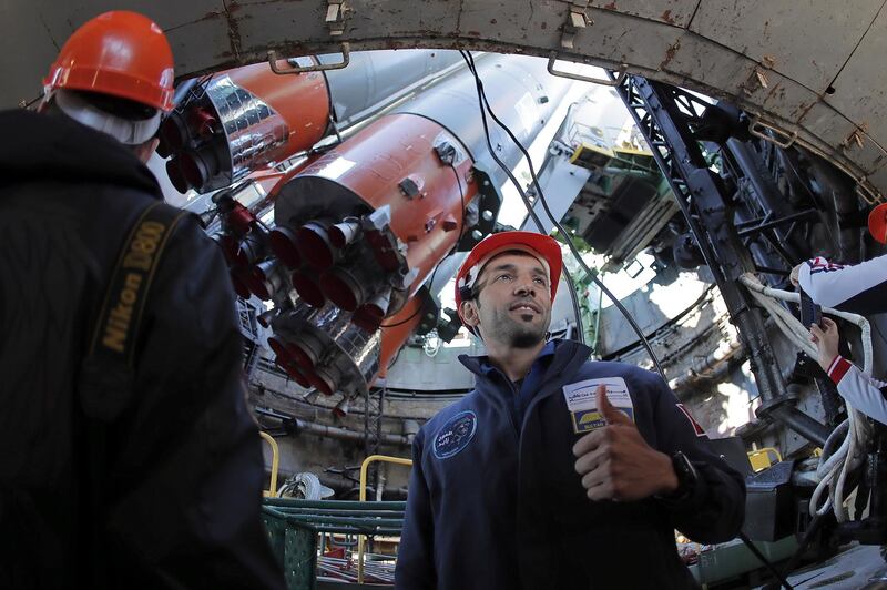 Backup crew member UAE astronaut Sultan Al Neyadi gets a close-up view of the booster from the blast area. Maxim Shipenkov / Pool Photo via AP