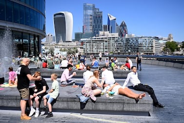People enjoy the summer weather in London in June. While the UK government plans to lift lockdown restrictions completely on June 21, the final decision rests on hospital admissions and death rates. EPA