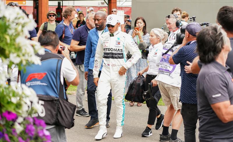 Lewis Hamilton arrives at the Paddock.