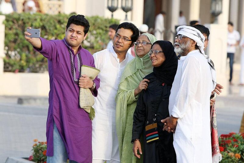 A family takes an Eid selfie in Dubai. Pawan Singh / The National