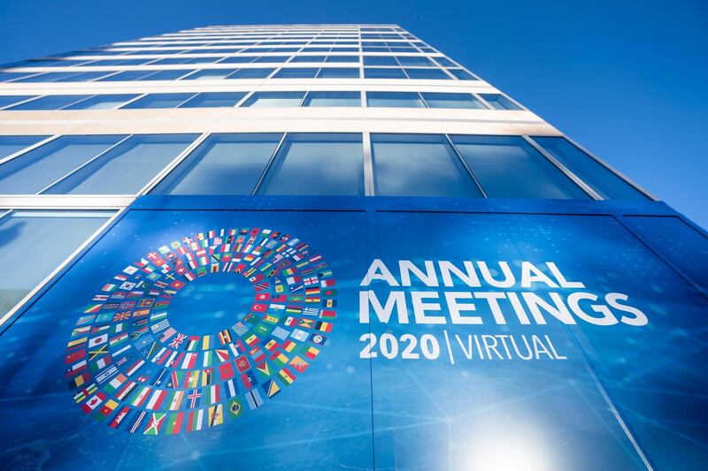 epa08743974 Signs for the International Monetary Fund (IMF) World Bank Group 2020 annual fall meeting, which has gone virtual due to the Coronavirus pandemic, outside IMF headquarters in Washington, DC, USA, 14 October 2020.  EPA/JIM LO SCALZO