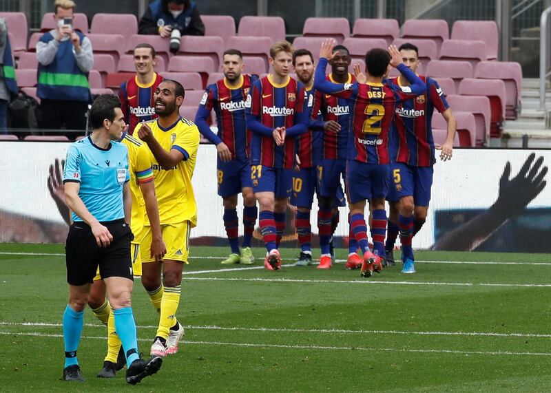 Lionel Messi celebrates with team-mates after scoring. EPA