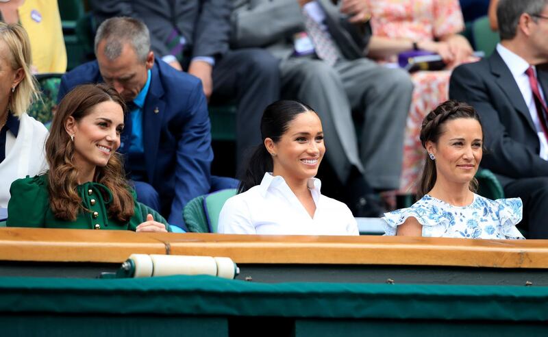 The Duchess of Cambridge and The Duchess of Sussex with Pippa Middleton. Photo: PA