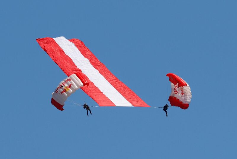 Parachutists are seen before the Austrian Grand Prix.