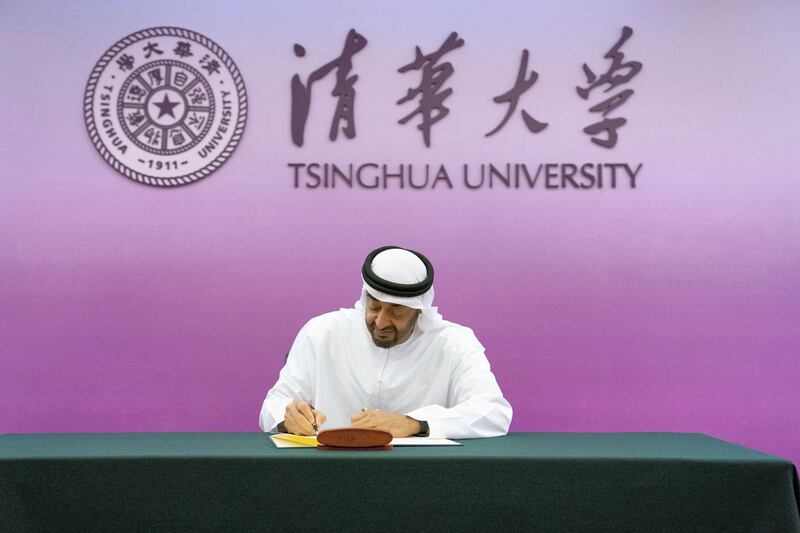 BEIJING, CHINA - July 23, 2019: HH Sheikh Mohamed bin Zayed Al Nahyan, Crown Prince of Abu Dhabi and Deputy Supreme Commander of the UAE Armed Forces (C), signs the guest book during a visit to Tsinghua University.

( Hamed Al Mansoori for the Ministry of Presidential Affairs )
---