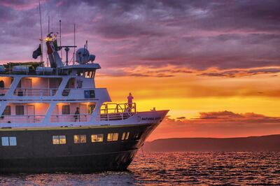 The Lindblad Expeditions ship National Geographic Sea Lion at sunset off Isla Ildefonso, Baja California Sur, Mexico. Photo by Michael S Nolan