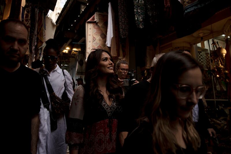 Meza meandered through the mostly empty cobblestoned alleyways of the Old City, stopping to peek into shops as a media scrum followed. AP