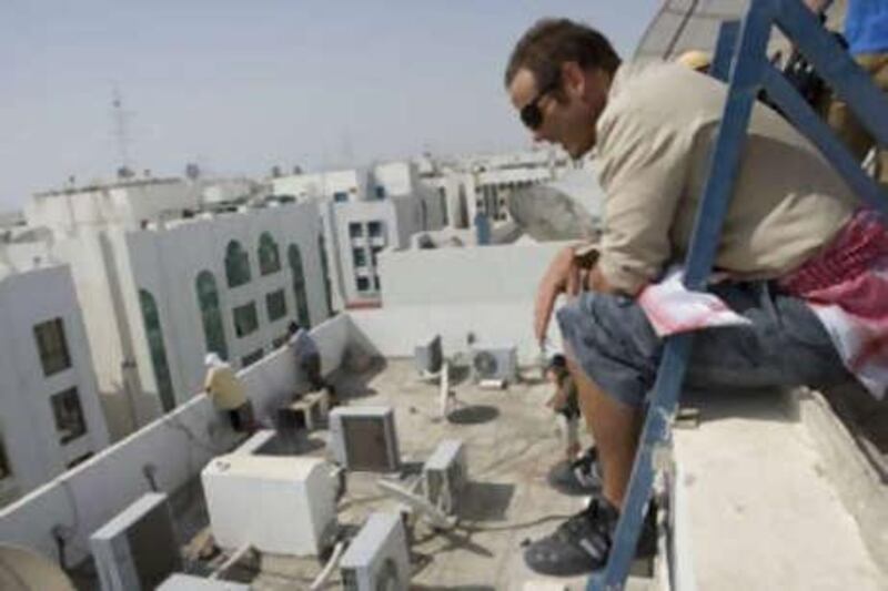 The director of <i>The Kingdom</i> Peter Burg, co-ordinates filming on the set in Abu Dhabi.