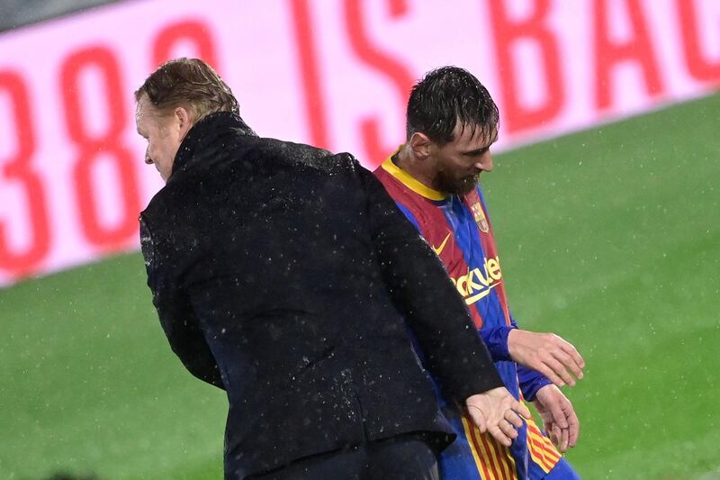 Barcelona's Dutch coach Ronald Koeman comforts Lionel Messi at the final whistle. AFP