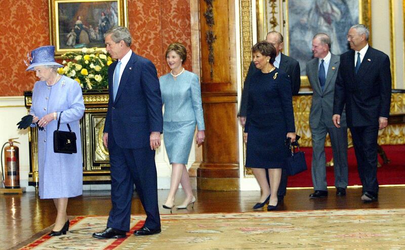 The queen accompanying Mr Bush, his wife Laura, then-US secretary of state Colin Powell and his wife Alma Powell, and the Duke of Edinburgh as they enter the Queen's Gallery at Buckingham Palace in 2003. AP