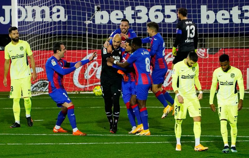 Eibar's Marko Dmitrovic celebrates with teammates after scoring. Reuters