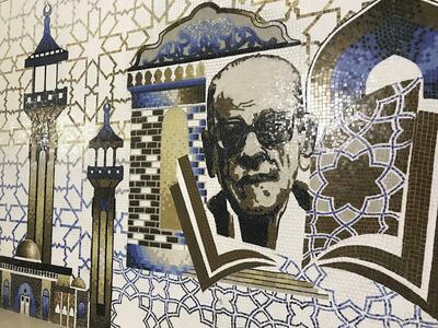 A mural of Naguib Mahfouz outside the entrance to the museum on the street by Sohair.  Courtesy Walt Curnow