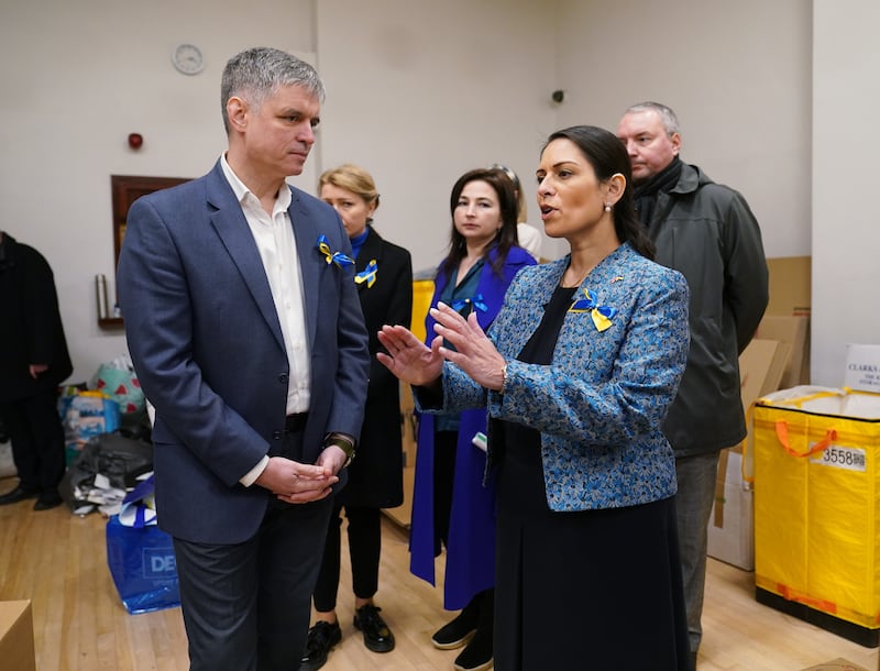UK Home Secretary Priti Patel with Ukraine's ambassador to the UK, Vadym Prystaiko, during her visit to the Ukrainian Social Club in London. Ms Patel said British staff were being flown to countries bordering Ukraine 'so we can fast-track and speed up applications'. Photo: PA