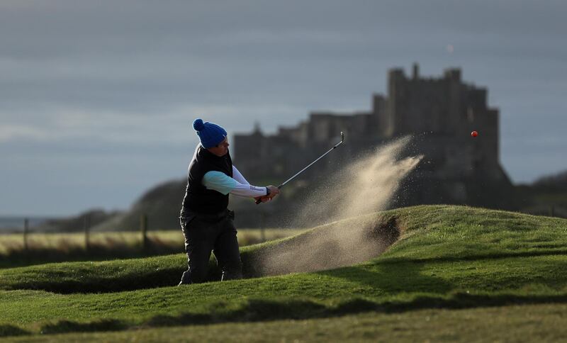 Members of the Bamburgh golf club play a round following the easing of lockdown in Bamburgh, Northumberland. Reuters