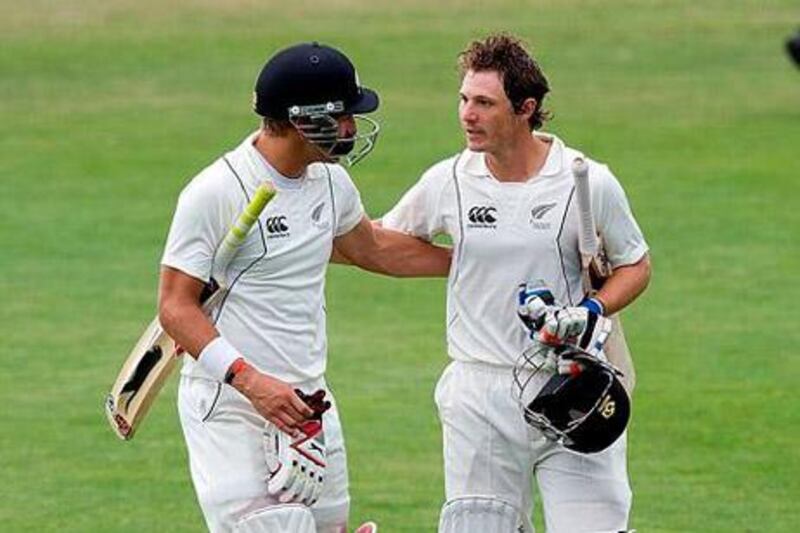 New Zealand's Neil Wagner, left, and BJ Watling celebrate their win. Marty Melville / AFP