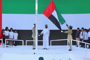 Sheikh Mohammed bin Rashid, Vice President and Ruler of Dubai, raises the UAE flag. Courtesy Dubai Media Office    