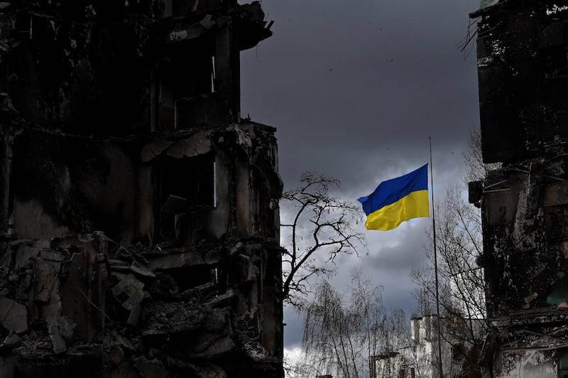 The Ukrainian flag flutters between buildings destroyed in bombardment in the town of Borodyanka. AFP