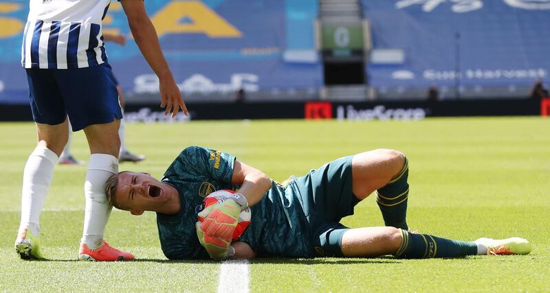 Arsenal's German goalkeeper Bernd Leno after getting injured during the match against Brighton on Saturday. AFP