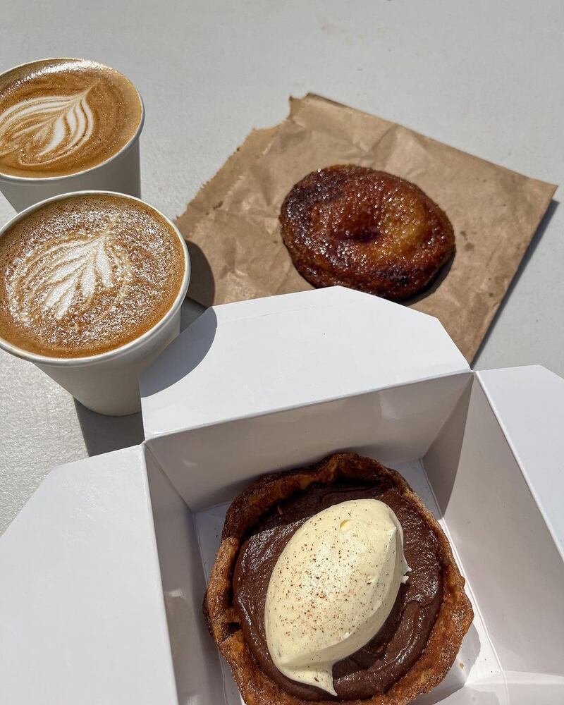 A creme brule cookie, two flat whites and a champurrado tart. 