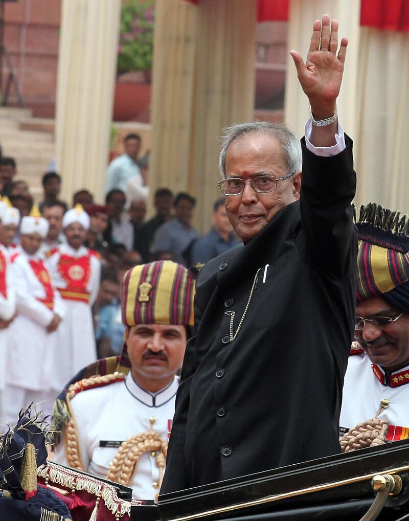 epa08637357 (FILE) - Former President of India Pranab Mukherjee greets people as he arrives in the royal traditional horse-drawn carriages or Buggy at Indian president house in New Delhi, India, 25 July 2012 (reissued 31 August 2020). Pranab Mukherjee died at the Army's Research and Referral Hospital in Delhi at the age of 84. The former president had undergone a brain surgery at the hospital and he was also detected positive for Covid19.  EPA/HARISH TYAGI