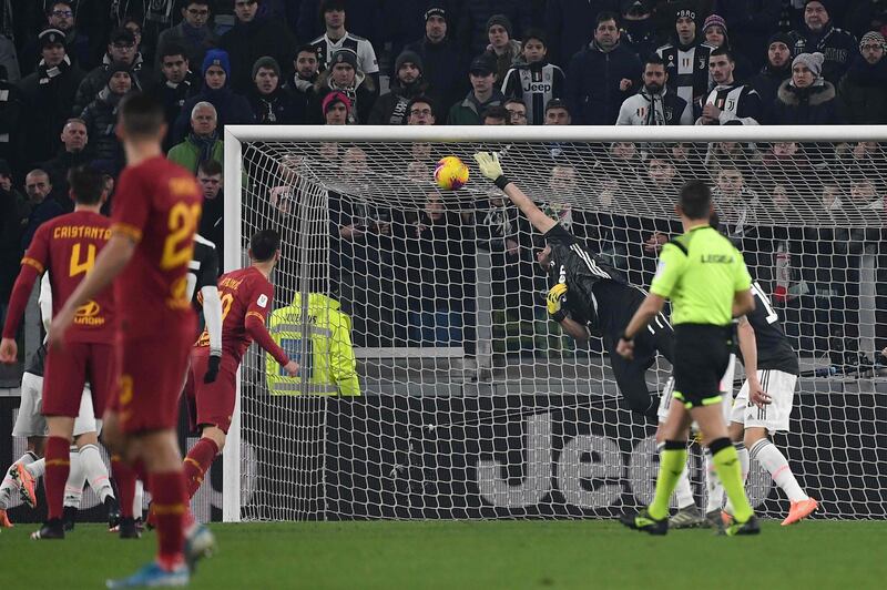 Juve goalkeeper Gianluigi Buffon cannot stop Roma forward Cengiz Under (not in picture) from scoring. AFP