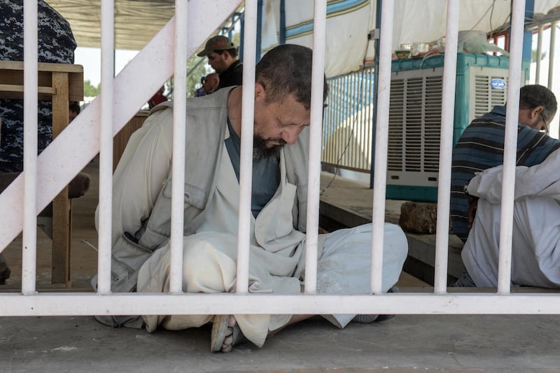 A man suspected of being an Egyptian member of the Islamic State group is detained by Iraqi soldiers at a temporary camp in the compound of the closed Nineveh International Hotel in Mosul on June 16, 2017 which was recovered by Iraqi troops from IS fighters earlier in the year. - A screening centre set up in the compound's fairgrounds sees a constant stream of Iraqis fleeing the battle for Mosul, awaiting their turn to be checked by the Iraqi forces who are searching for suspected Islamic State (IS) group members.
The small fairground lies at the end of a pontoon bridge across the Tigris recently opened to civilians that is the only physical link between the two banks of the river. (Photo by MOHAMED EL-SHAHED / AFP)