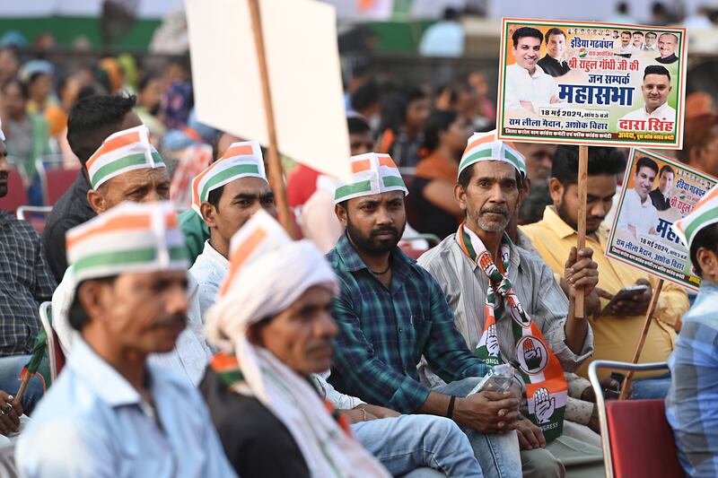 Attendees at a campaign rally for India's opposition leader Rahul Gandhi in Delhi, India, on Saturday, May 18, 2024.  India's election is past the halfway mark, with campaigning between the main political parties heating up just like the soaring temperatures across the country. Photographer: Prakash Singh / Bloomberg
