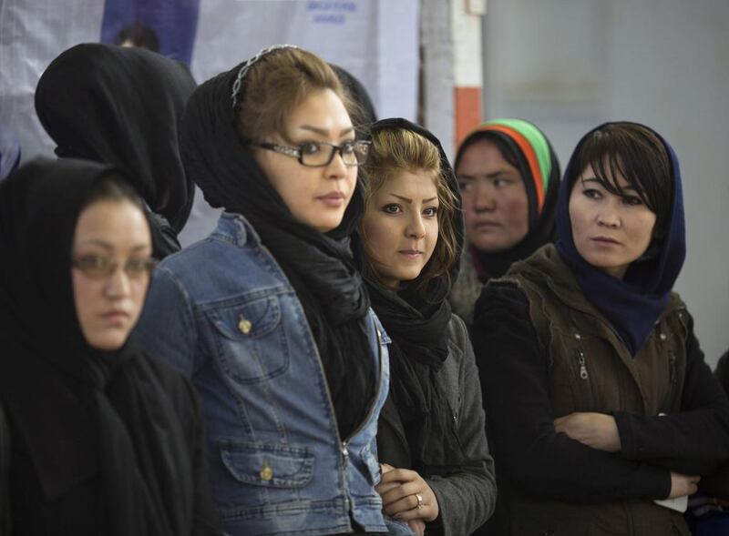 Afghan women watch a sport ceremony at a stadium in Kabul. A programme to train more female journalists aims to encourage women’s perspectives on the country. Morteza Nikoubazl / Reuters / March 8, 2014