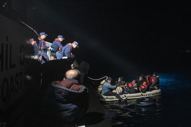 Migrants and refugees are seen on an inflatable boat during a rescue operation by the Turkish Coast Guard on the Aegean sea between Turkish resort town of Bodrum and the Greek island of Kos last week. Getty Images
