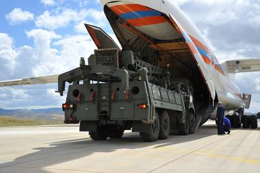 Parts of Russia's S-400 missile defence system are unloaded from a plane at Murted air base near the Turkish capital on July 12, 2019. Turkish Defence Ministry via Reuters