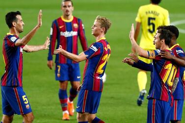 Barcelona's Lionel Messi, right, celebrates with teammates after scoring against Villareal. AP