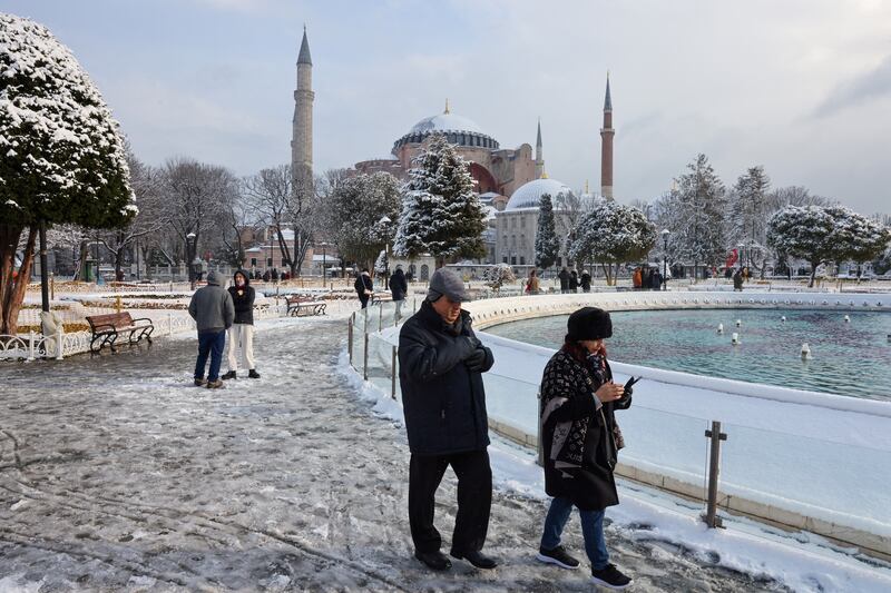 Tourists walk in Sultanahmet Square. Reuters