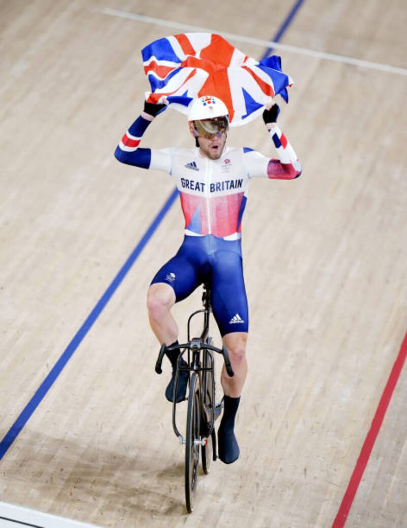 Great Britain's Matthew Walls celebrates gold in the Men's Omnium Points Race.