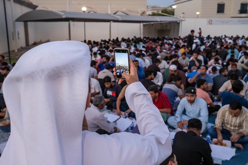 Worshippers attend a communal iftar at Al Farooq Omar bin Al Khattab Mosque in Dubai. Antonie Robertson / The National