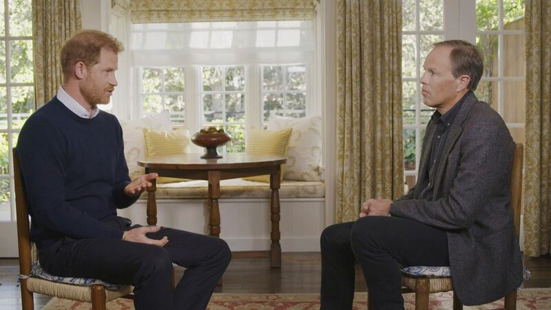 Prince Harry, left, speaks with ITV's Tom Bradby for the programme Harry: The Interview. AP