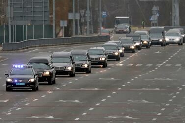 A motorcade of hearses carrying the bodies of the eleven victims of the Ukraine International Airlines flight 752 plane disaster moves along a road before a memorial ceremony. Reuters