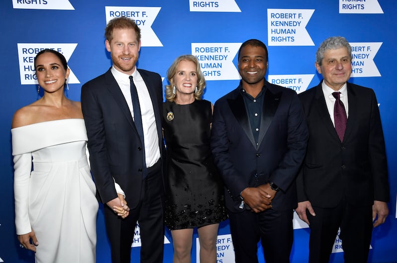 From left, the Duchess of Sussex, Duke of Sussex, Kennedy, Frank Baker and Michael Polsky. AP