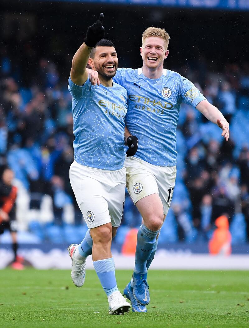 Sergio Aguero of Manchester City celebrates with teammate Kevin De Bruyne after scoring against Everton at Etihad Stadium . Getty