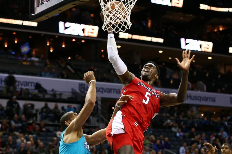 Washington Wizards forward Bobby Portis shoots the ball against Charlotte Hornets forward Nicolas Batum in the first half at Spectrum Center.Jeremy Brevard-USA TODAY