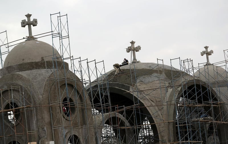 Construction workers build the New Coptic Cathedral in Egypt's new administrative capital, located north of Cairo. Reuters