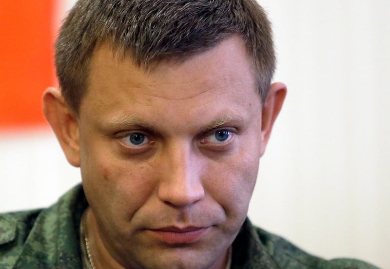 FILE - In this Sunday, Aug. 24, 2014 file photo, Alexander Zakharchenko, Prime Minister of the self-declared Donetsk People's Republic, is seen in Donetsk, Ukraine. The leader of the Russia-backed separatists fighting in eastern Ukraine's Donetsk region was killed Friday, Aug. 31, 2018 by an explosion at a cafe, the separatists' news agency said Friday. Rebel news agency DAN said the afternoon explosion killed Alexander Zakharchenko, 42, the prime minister of the self-declared Donetsk People's Republic. (AP Photo/Sergei Grits, file)