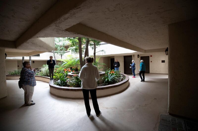 Residents take part in a socializing hour in the courtyard of their apartment complex while keeping a social distance during the global outbreak of the coronavirus disease (COVID-19), in Pasadena, California, U.S. REUTERS