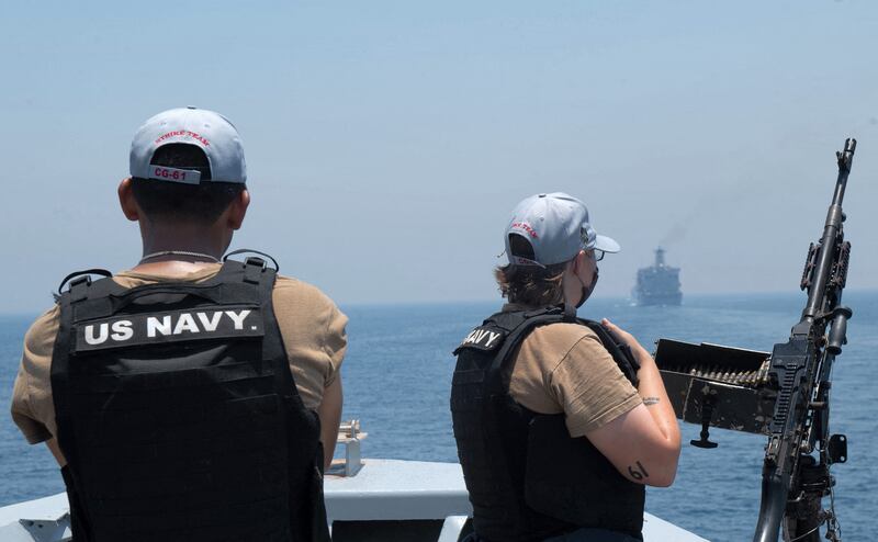 US Navy personnel aboard the guided-missile cruiser USS Monterey looking on while the vessel transits through the Strait of Hormuz, on June 3.  (Chelsea Palmer/US NAVY/ AFP).