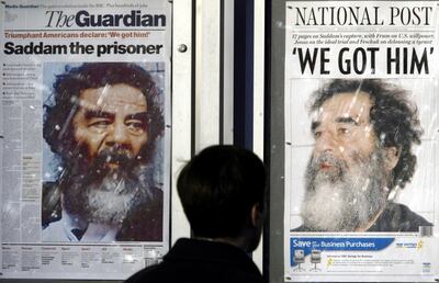 The front pages of international newspapers on December 15, 2003 – two days after Saddam Hussein's capture in Iraq, as seen in Washington, DC. AP