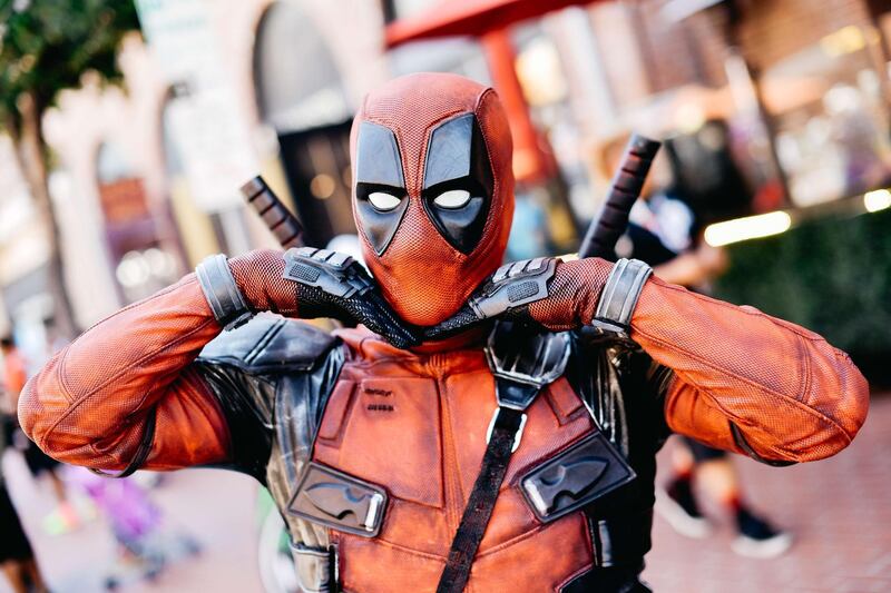 A cosplayer is dressed as Deadpool. AFP