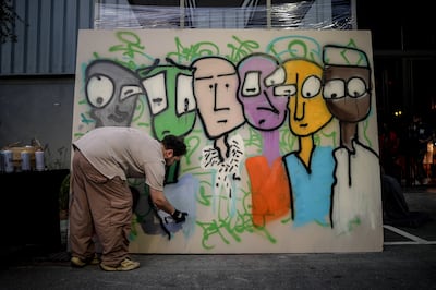 Mohammad ElChawa working on his mural at Artists for Peace – Shadow Ban This! 