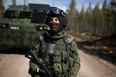 A Finnish soldier takes part in a military exercise exercise. Along with Sweden, his country is seeking to join Nato. Reuters