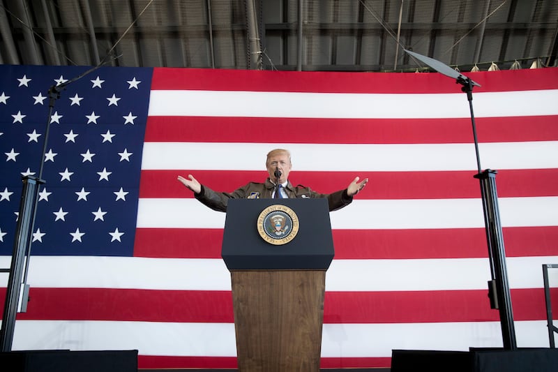 President Donald Trump speaks at a hanger rally at Yokota Air Base in Tokyo, Japan. Andrew Harnik / AP Photo