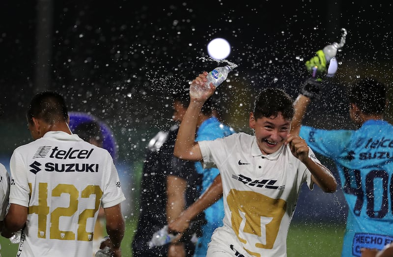 Player of Pumas celebrate after winning the U14 Mina Cup final.